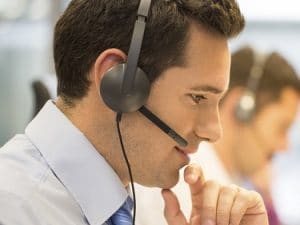 Call center team at office on the phone with headset